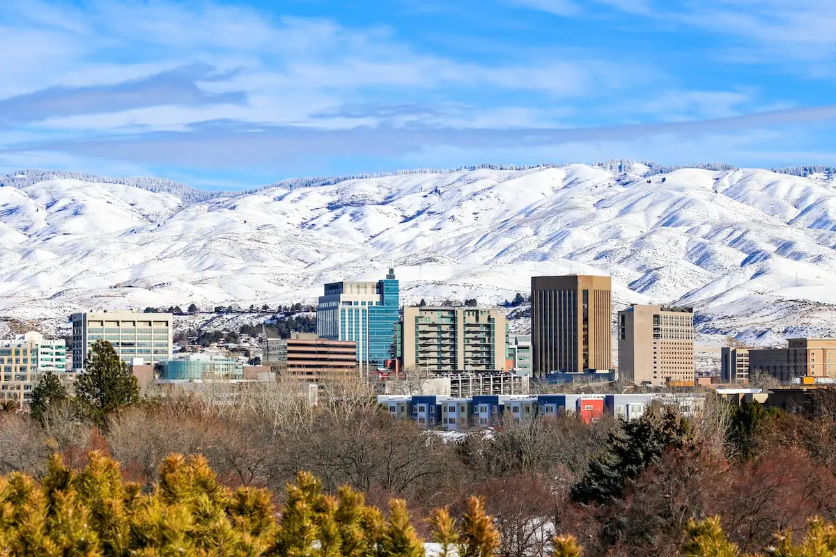 Boise, Idaho skyline with snowy mountains, illustrating opportunities for wholesale real estate in Boise.
