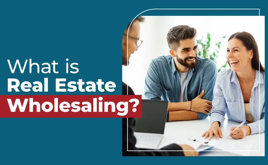 Real estate agent meeting with smiling clients to explain how wholesaling in real estate works, with text overlay asking “What is Real Estate Wholesaling?”