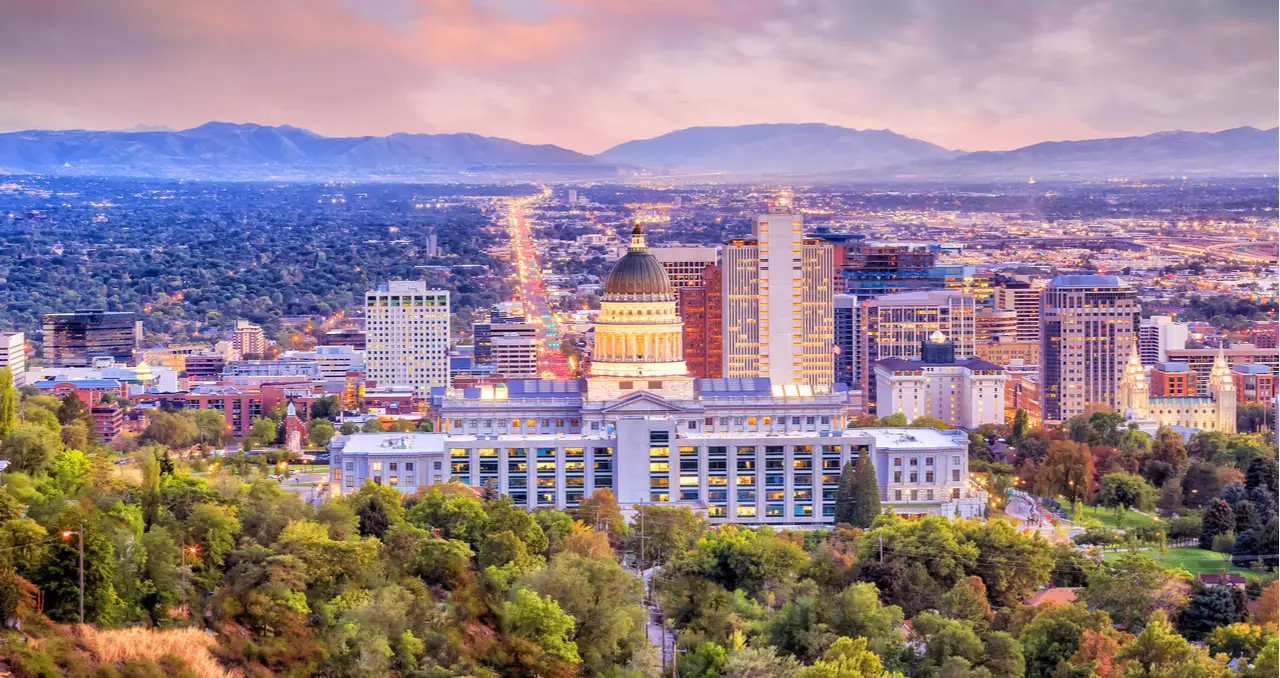 Salt Lake City skyline at sunset, representing opportunities for beginners exploring wholesale real estate in Utah.