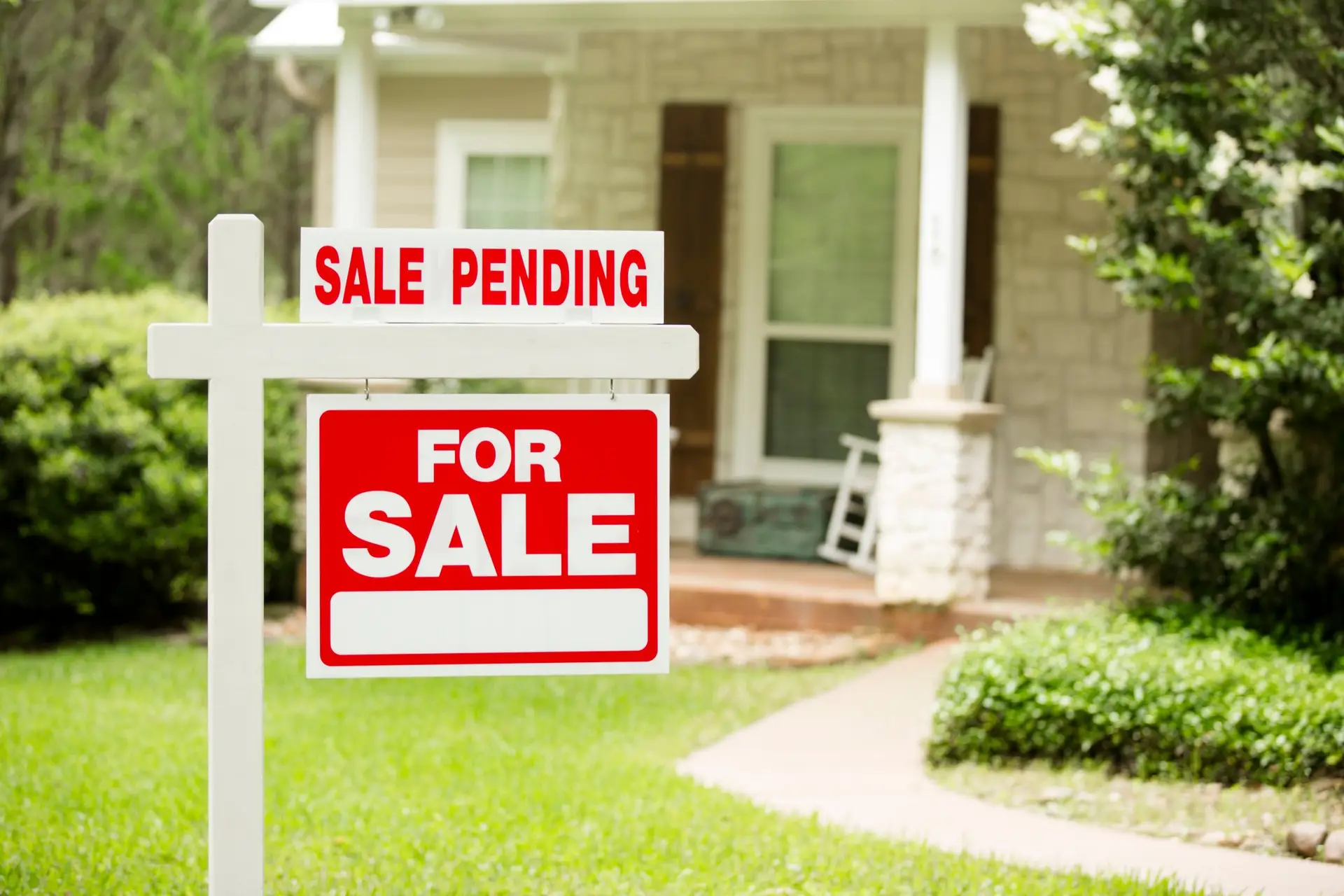 Real estate “For Sale” sign with a “Sale Pending” label, representing the disposition phase in wholesaling where the contract is assigned or the property is sold.